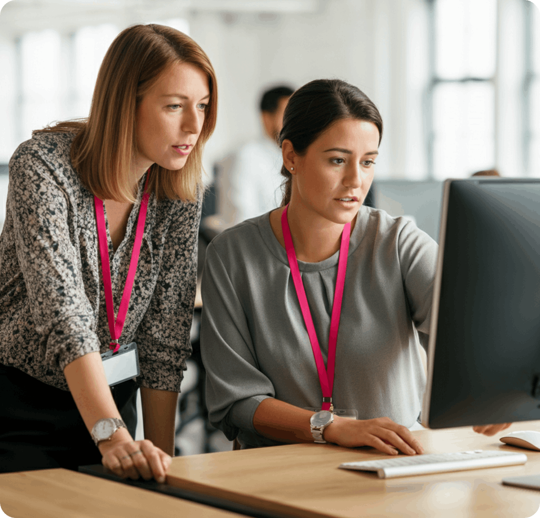 Two women looking at a computer screen