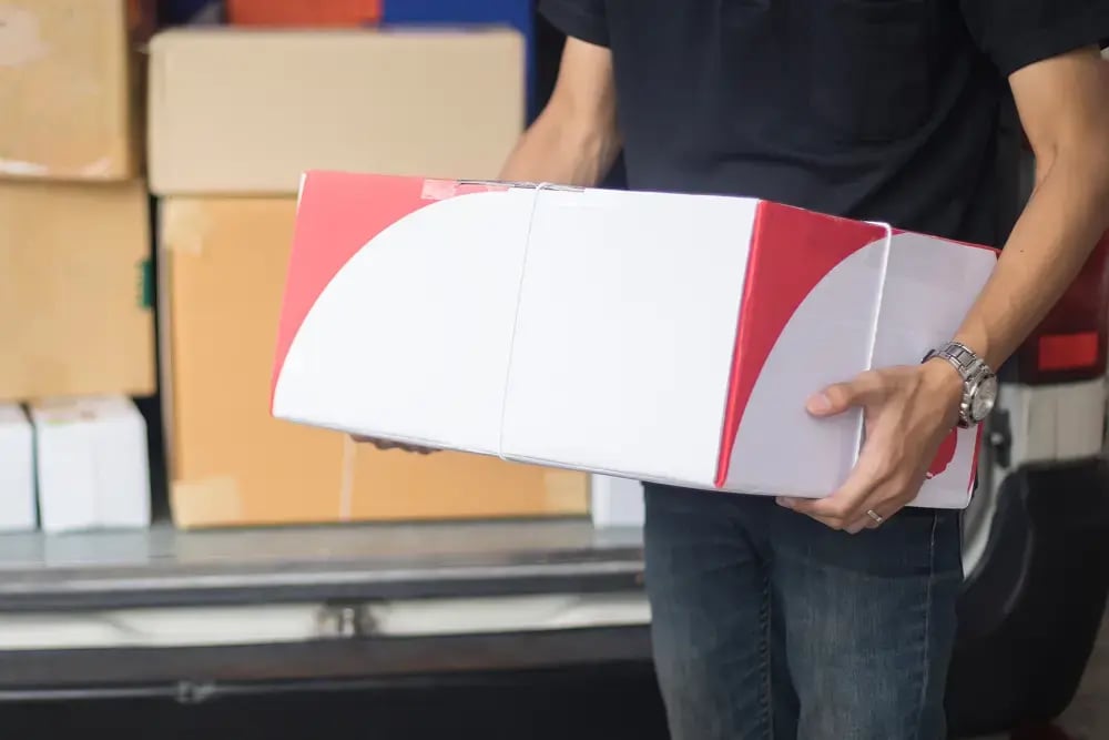 Courier holding parcels