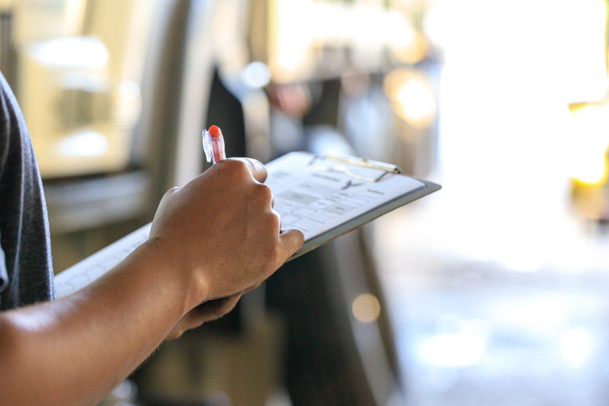 man holding clipboard
